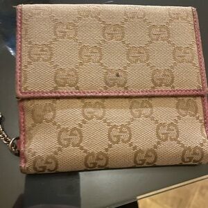 Authentic Gucci monogram wallet with pink interior
